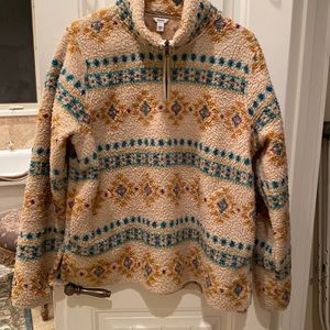 Fleece half zip pullover.  Aztec pattern.